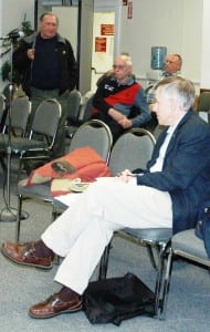 Philipstown Highway Superintendent Roger Chirico responds to comments from the Old Road Society, whose president, Terry Zaleski (foreground), listens attentively. Photo by L.S. Armstrong