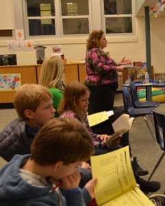 David and Ben Higbee, in the foreground and accompanied by their family, listen to the Garrison School Board budget presentation on March 6 as part of Boy Scouts merit badge requirements, as Sue Huetter speaks to the board. Photo by J. Tao