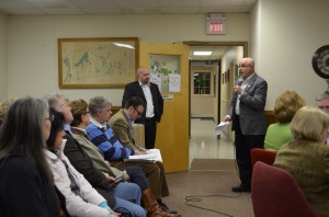 Cold Spring Area Chamber of Commerce Chair Vinny Tamagna, standing right, speaks about the importance of the Main Street corridor improvements for Cold Spring's businesses, as CHA representative Joe Cimino, standing left, listens. Photo by J. Tao