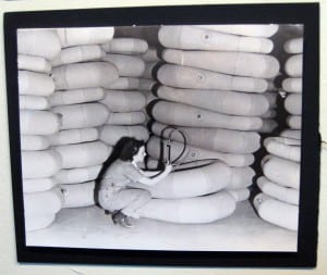 Photo of a worker preparing life rafts for shipment at Beacon's New York Rubber Company, 1943 (Image courtesy of the Beacon Historical Society)