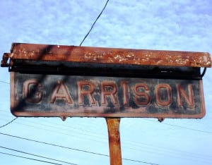 The sign stood alone and neglected before its restoration. Photo courtesy Barbara and Thomas Scuccimarra