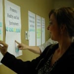 Maureen Kenney, American Lung Association, casts one of her votes for reducing chronic disease at the Putnam County Public Health Summit III. Photo courtesy of Putnam County Health