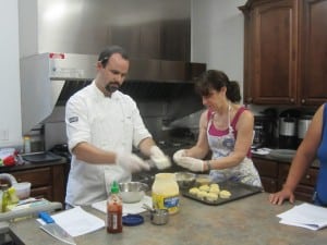 Chef Stef, left, and volunteer Jana Kolpen shape the crab cakes.