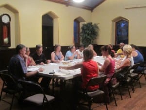 At the end of the session, cooking class participants gather to sample the goods.