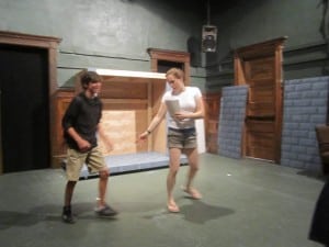 Director and choreographer Katie Bissinger works with cast member Jeremy Roffman.