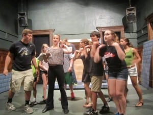 The cast rehearsing one of the musical numbers. 