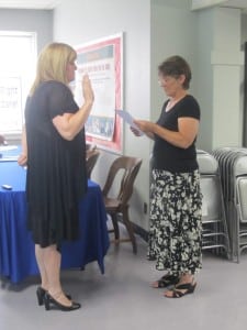 Gillian Thorpe, left, takes the oath of president from Philipstown Town Clerk Tina Merando. Photo by A. Rooney