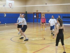 Rec volleyball players in action at the community center on a recent Thursday night (Photo by John Maasik)