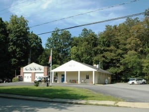 The American Legion building, right (file photo by L.S. Armstrong)