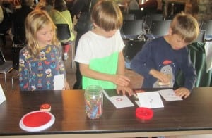 Children make tracking ID cards after the coyote presentation.