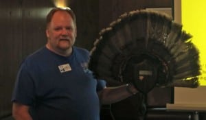 Environmental Educator Carl Heitmuller talks up turkey tailfeathers and explains why turkeys flare their tails. Photo by A. Rooney