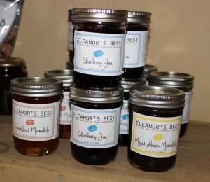 On a shelf at Country Goose: three of the first four of Eleanor's Best flavors: Blueberry Jam, Grapefruit Marmalade, and Meyer Lemon Marmalade.