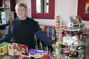 Shirley Wenlock-Hot behind a counter laden with British goodies.  (Photo by A. Rooney)