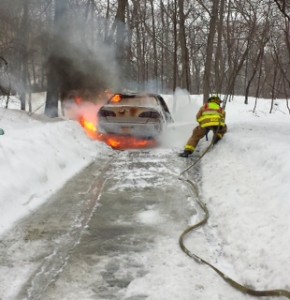 A Garrison firefighter controls a vehicle fire Feb. 19. Photo by Joseph Mercurio