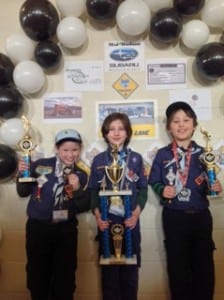 Jordan Albertson, Jude Columb and Gael Frezza stand in the Winner's Circle. Photo courtesy of Pack 137