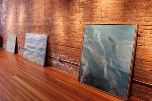 Two Fredericka Foster paintings waiting to be hung, just prior to the opening of Water Way. (Photo by A. Rooney)