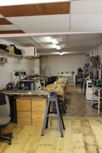 The long interior of the woodworking studio at Lord of the Strings