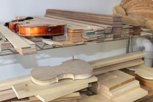 The shelves of a luthier contain very specific wood shapes. 