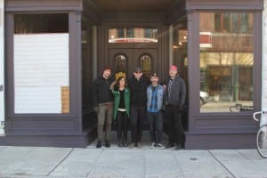 The Peoples Bicycle team gathers outside their new retail shop. From left, Bryan Richardson, Sarah Womer, Jon Miles, Aaron Hawkins and Kyle Helland (Photo by S. Hixson)