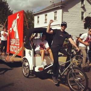 Peoples Bicycle proprietor Jon Miles and his pedi-cab. Spirit of Beacon Day Parade, 2012. (Photo by Jennifer Glennon König)