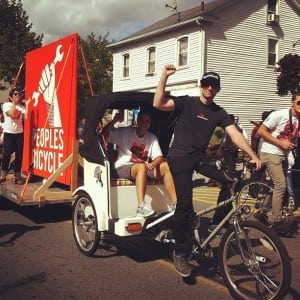 Peoples Bicycle proprietor Jon Miles and his pedi-cab. Spirit of Beacon Day Parade, 2012. (Photo by Jennifer Glennon König)