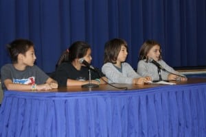 At a recent Garrison GEMS assembly, fifth graders, from left, Saja Digiovanni, Rachel Iazicoli, John Vogel and Sophie Stark held a forum about bus safety and answered questions from elementary students.