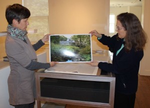 Modern Residential Architecture co-curators Lisa Weilbacker, left, and Trudie Grace examine a photograph being considered for the exhibition, prior to its opening. (Photo by A. Rooney)