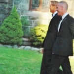 Randy Florke, left, and Sean Patrick Maloney cross the church lawn on their first, unofficial exit from the church after the wedding. Photo by L.S. Armstrong