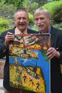 After being inducted into the Hall of Fame, George Stevenson, right, presented his friend, former teammate and fellow Vietnam vet Pat Kelliher, with one of his paintings. Photo by M. Turton