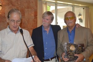 Bill DiCastro, left, and Lou Amoroso, right, presented George Stevenson with two plaques, marking his induction into the Fast Pitch Softball Hall of Fame. 