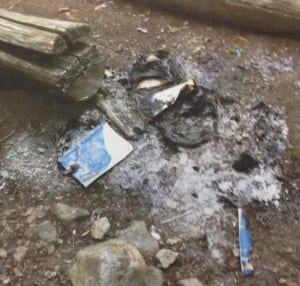Book burning remnants litter a local trail. (Photo provided)