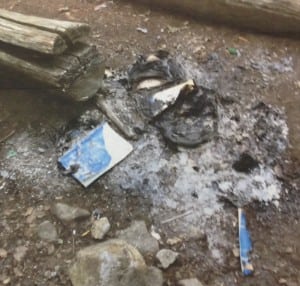 Book burning remnants litter a local trail. (Photo provided)