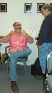 Richard Butensky talks to Mary Finger, Planning Board member, after the Aug. 7 Town Board meeting. Photo by L.S. Armstrong