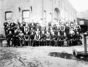 In the latter 19th century, WPF workers gather for a group photo by the machine shop. Photo courtesy of the Putnam History Museum