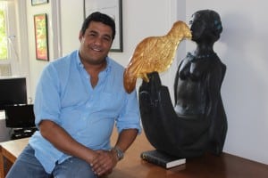 Peter Sanders, pictured in his office, next to a sculpture by the subject of his documentary, Altina Schinasi. (Photo by A. Rooney)