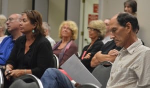 Grace Snowden, left, and Robert Juby, right, both live on East Mountain Road South but differ over whether or not the road should be paved.