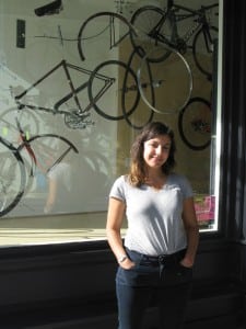 Tess Elliot with her winning installation at People’s Bicycle, 430 Main St., Beacon. Tess has returned to school this fall to complete an MFA.