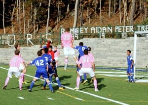 Peter Hoffmann launches a header in the Senior Night game versus YMA. Decorations by Jill Heitmann and Santa Warren. (Photo by Scott Warren)