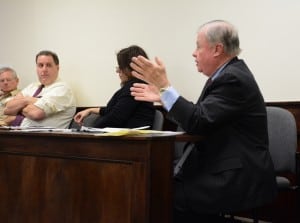  Legislator Roger Gross, right, makes a point about the Butterfield development, as Legislator Dini LoBue, center, and Legislative Counsel Clement Van Ross, far left, and Legislator Joseph Castellano listen. 