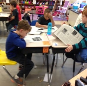 Students in Amy Kuchera's fourth-grade class check out their work.