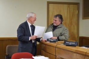 Attorney William Florence, left, with Water and Sewer Superintendent Greg Phillips during a break in Tuesday's meeting, is providing legal counsel on an interim basis until trustees appoint a new village attorney. (Photo by M. Turton)