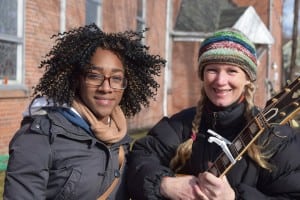 Shameika Hanson, left, and Linda Richards, marched and sang together.