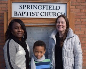Eight-year-old Xavier Jones, pictured here with his principal Priscilla Kelly, left, and his teacher Kyesha Norkus, was this year's youngest essay contest winner.