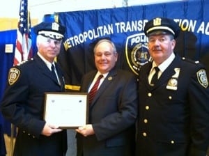 Schramek (center) accepting an award in 2013 on behalf of the Putnam County Sheriff’s Office for its support of the MTA Canine Unit program.