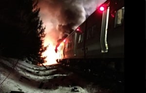 A photo of the burning and wrecked Harlem Line train.