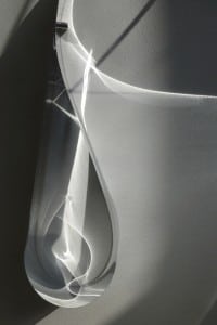 One of Jaanika Peerna's artworks made of reflective film is attached to a wall. As the daylight changes, the artwork changes accordingly. (Image courtesy of the artist)