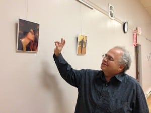 Photographer Markie Baylash gives a commentary of the images on display in the exhibition of his work at the Howland Library (Photo by A. Rooney)