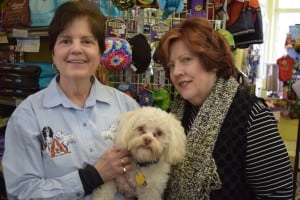 Mary Jane Nagel, left, and her partner Susan Elliot-Nagel with Buster, owners of Reigning Dogs and Cats Too, which will close April 1
