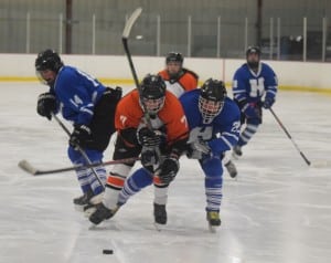 Haldane players, freshman Joe Orza (#14) and sophomore James Sherman (#22), defend against an attacking Pawling player.