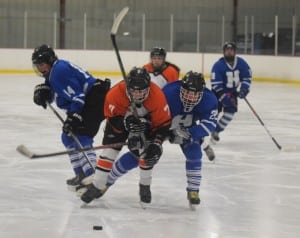 Haldane players, freshman Joe Orza (#14) and sophomore James Sherman (#22), defend against an attacking Pawling player.